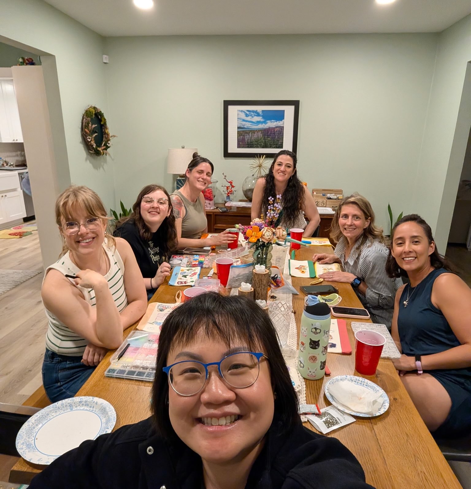 Mandi and friends gathered around a table at a recent book club meetup